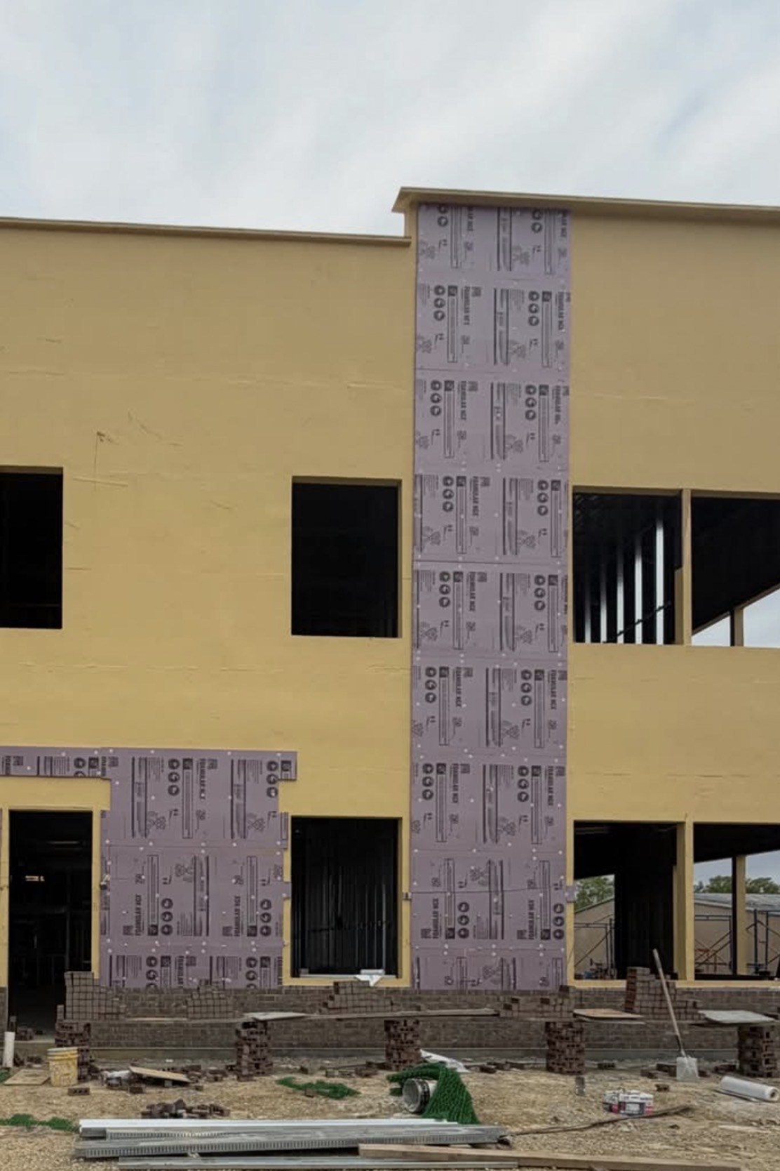 Storefront opening framed for next-phase glazing